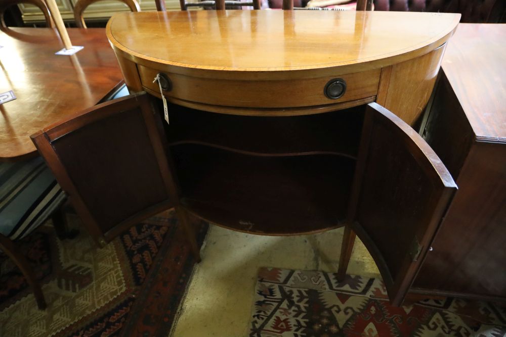 A Sheraton revival mahogany demi lune cabinet, width 95cm, depth 42cm, height 94cm